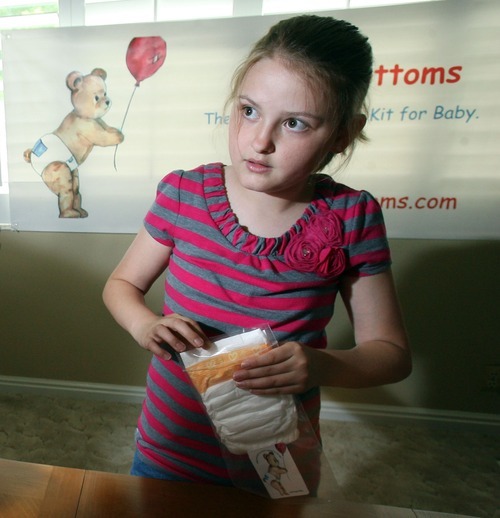 Steve Griffin  |  The Salt Lake Tribune
Nine-year-old Katelynn O'Brien, packages Ready Bottoms in her Sandy, Utah home. Katelynn came up with a unique idea for her school's invention fair: a diaper with a pocket for wipes. She and her mother, Aimee O'Brien, have patented the invention and have started a home-based business called Ready Bottoms.